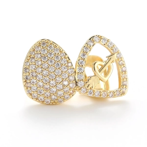 Golden heart and arrow stud earrings set with micro-paved cubic zirconia on white background