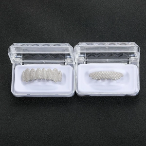 Macro view of hip hop grillz with inlaid cubic zirconia in transparent jewelry storage boxes