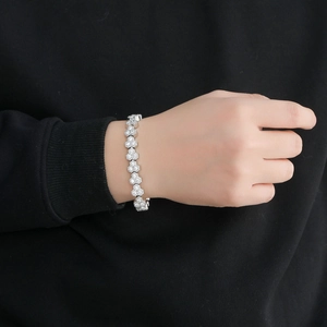 10mm silver tennis bracelet with flower-shaped zircon clusters worn on a male wrist