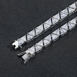 Macro detail of 9mm triangle zircon tennis chain with secure silver-tone box clasp