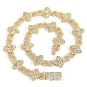 Hip hop style clover necklace and bracelet set in gold finish with sparkling zircons