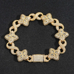 Detail of gold clover bracelet with infinite symbols and shimmering 5A cubic zirconia