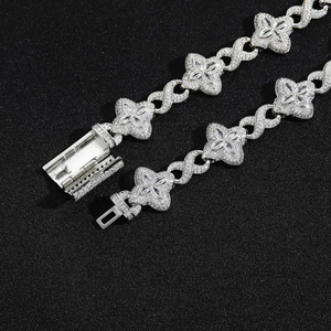 Hip-hop silver bracelet with clover motifs and 5A cubic zirconia on black background