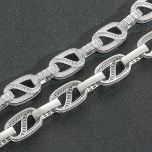 Close-up of hip hop silver necklace chain featuring iced-out square links and zircons