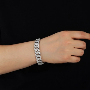 15mm silver cuban link bracelet with baguette zircon stones worn on wrist