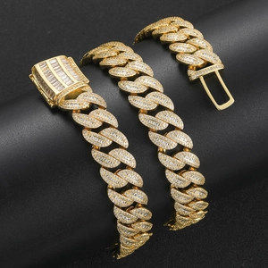 Detail of 15mm gold Cuban link chain with mixed baguette and round zircon stones
