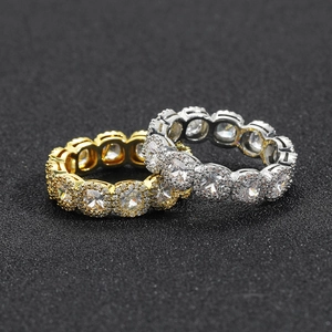 Detailed macro view of gold and silver eternity rings with full cubic zirconia paving