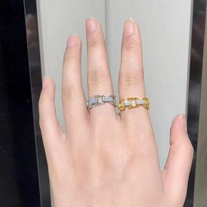 U-shaped horseshoe buckle ring with micro-paved zircons in gold and silver finishes