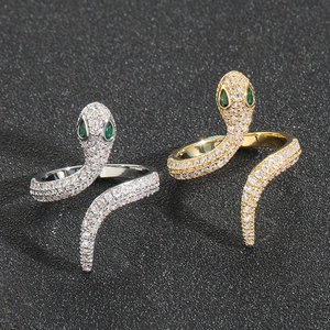 Lussuosi anelli a serpente in oro 18 carati e argento con zirconi e occhi di gemma verde