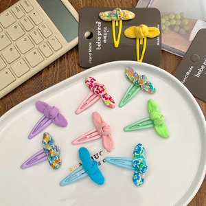 Pastel fabric bow hair clips for girls featuring floral and solid macaron colors