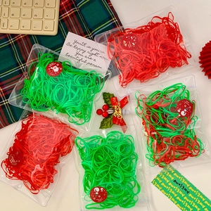 Five-pack of colorful elastic hair bands with festive Christmas theme packaging