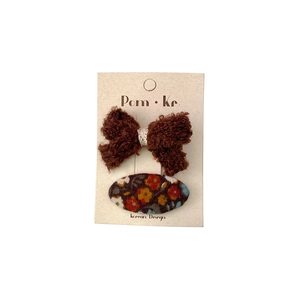 Korean style floral fabric and brown plush bow hair clip set on a display card