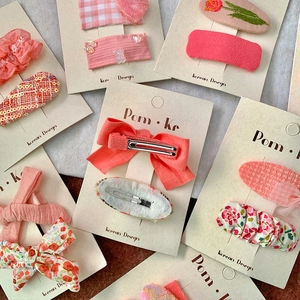 Pink Korean style fabric bow hair clips for girls with floral and sequin patterns
