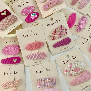 Pink heart and cherry woven hair clip set for kids featuring sweet tweed and plaid patterns