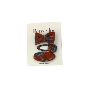 Three-piece burnt orange and gray plaid fabric hair clips set with silver glitter threads