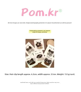 Detailed view of floral fabric hair clips with measurements 6.3cm by 5.1cm size specs