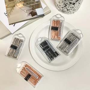 U-shaped metal bobby pins set in clear storage box with anti-slip wavy design