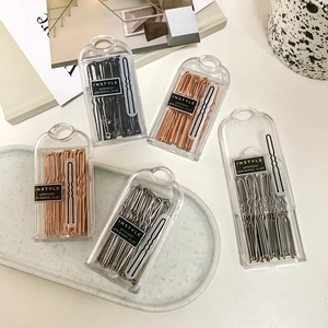 U-shaped metal hairpins set with 24 wavy bobby pins in a clear storage box