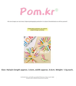 Detailed macro view of colorful macaroon hair clips showing size dimensions and patterns
