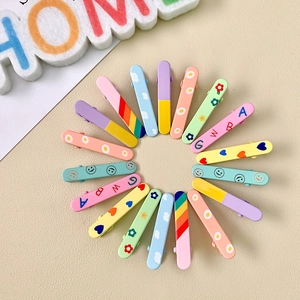 16-pack colorful macaron kids hair clips with cartoon prints in a circular arrangement