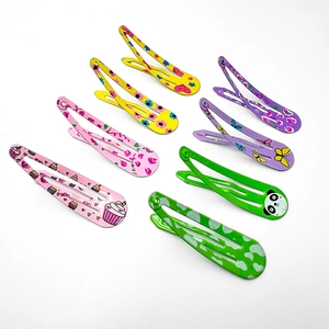 Set of 7 colorful floral and animal pattern metal hair clips for girls on white background