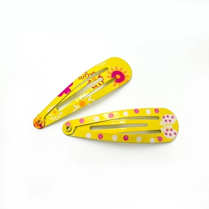 Floral and polka dot yellow metal BB hair clips for girls in a stylish drop shape