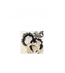 Detail view of 12cm lace hairband and champagne pleated headband weighing 18.6g