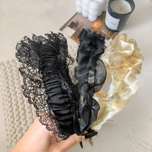 Elegant pleated mesh and lace headbands in black and champagne gold for a stylish hair look