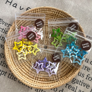 Set de pinzas para el pelo con forma de estrella y purpurina en colores pastel