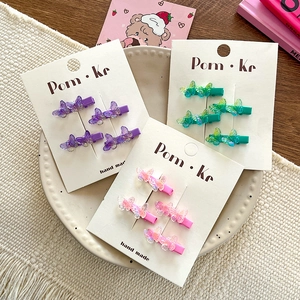 Set of 4 transparent gradient bow hair clips in purple, teal, and pink for girls