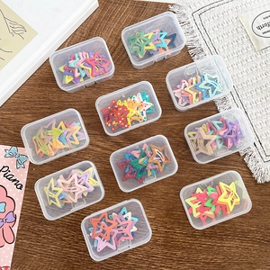 Colorful star-shaped hair clips set in storage boxes for kids' hair styling accessories