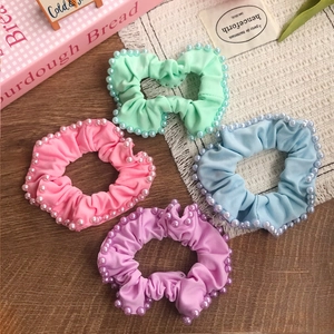 Set of four pastel scrunchies with pearl edges in mint pink blue and purple colors