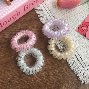 Set of four colorful spiral telephone wire hair ties for high elastic ponytail styling