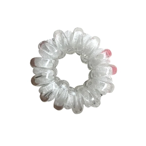 Elastic clear and pink spiral telephone wire hair tie for high ponytail styling