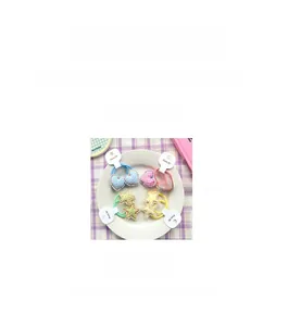 Detail of colorful plaid fabric hair ties with heart and star shapes for kids