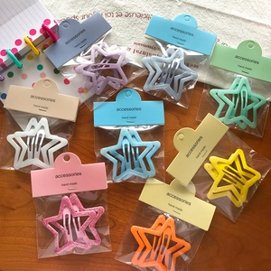 Lot de neuf barrettes à cheveux en forme d'étoile pailletée pour filles sur bois
