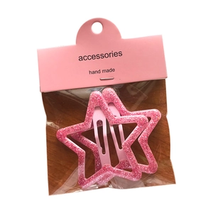 Lot de deux barrettes étoiles roses pailletées sur carte d'accessoires faits main