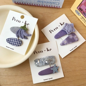 Charming purple plaid sequin hair clips for children featuring embroidery and fabric details
