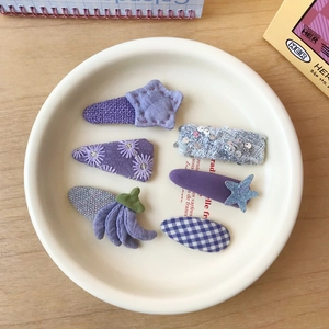 6-piece purple plaid and sequin hair clips set with floral and star fabric designs