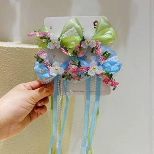 Barrettes à cheveux fleur avec bordure en dentelle et longs glands perlés