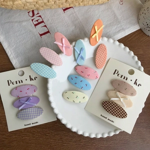 Set of cute oval fabric hair clips featuring plaid patterns and floral cherry prints