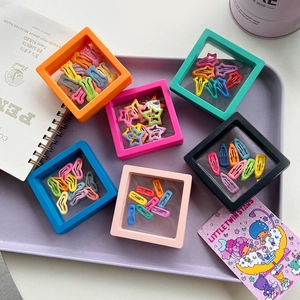 3D floating jewelry display frames with candy colored hair clips and protective PE film