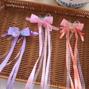 Set di tre fermagli per capelli con fiori e nastri lunghi in viola e rosa per bambine