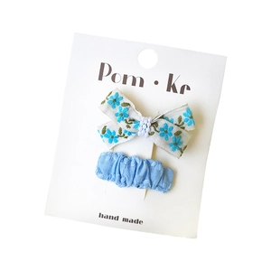 Floral embroidery and sky blue fabric bow hair clips set for kids on display card