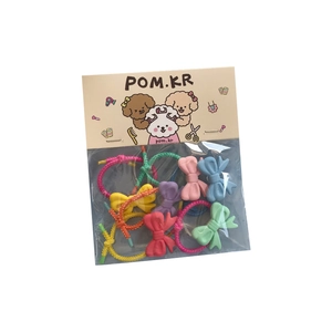 Colorful kids hair ties set with matte bow charms in pastel pink, yellow and blue