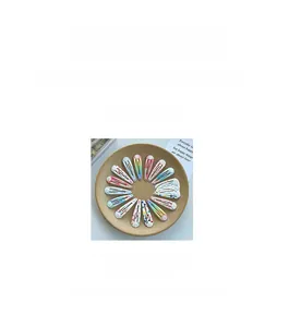 Close-up of cute printed water-drop BB hair clips with colorful patterns in a tray