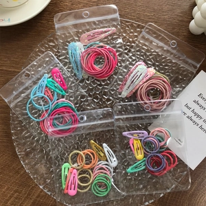 Colorful candy-colored hair clip and elastic hair tie set in a transparent pouch