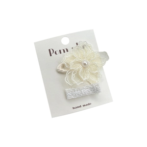 Elegant handmade lace flower hair clip with pearl center for girls on a gift card