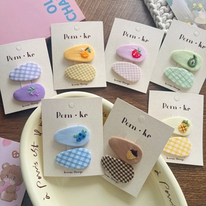 Close-up of cute plaid and fruit embroidery hair clips set for girls and women