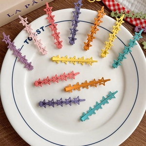 Colorful star-shaped hollow hair clips in macaron colors for girls hair styling